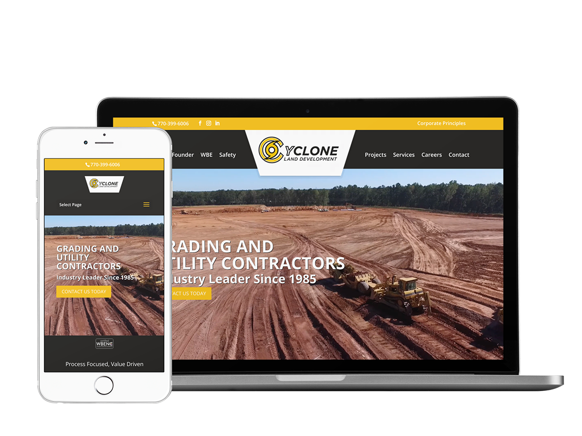 A mobile phone and tablet displaying the website for a construction company specializing in cyclone land development.