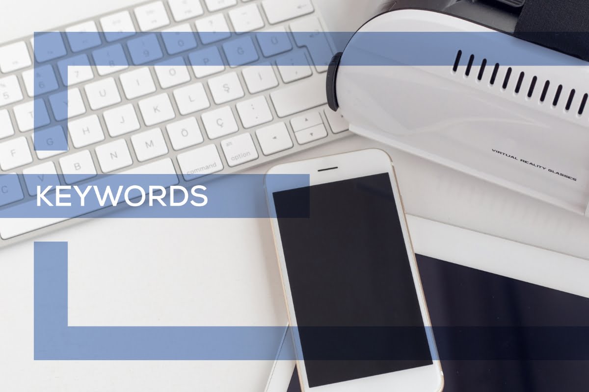 A laptop, cell phone, printer and keyboard with the words keyword research tips.