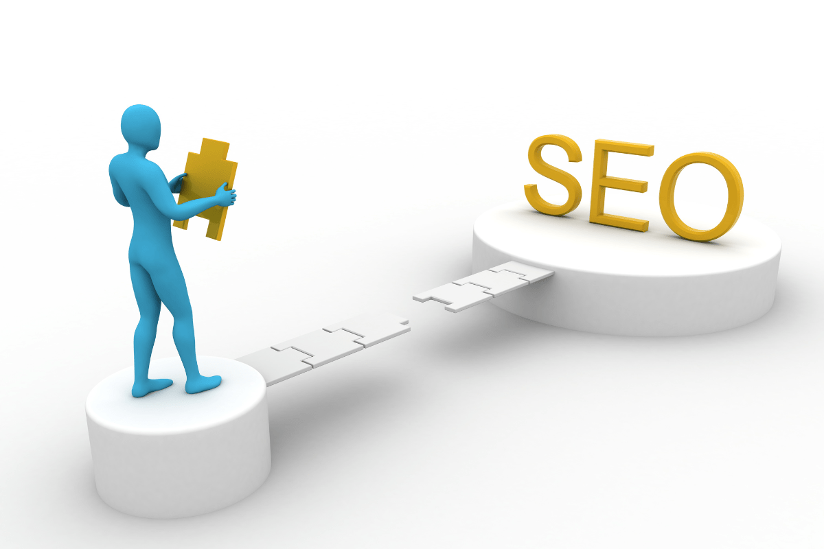 A person standing on a platform, holding a piece of puzzle going to the word SEO.