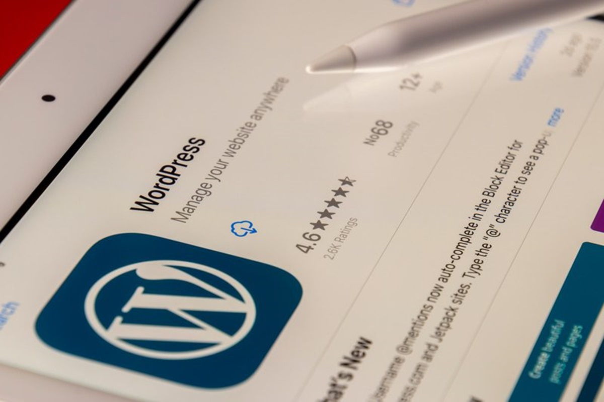 A WordPress app is displayed on an iPad.