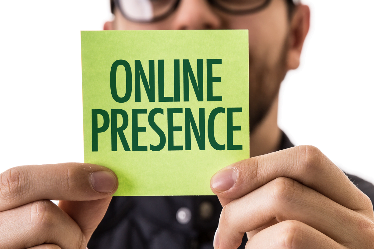 A businessman showcasing the importance of your online profile through a paper labeled "online presence."