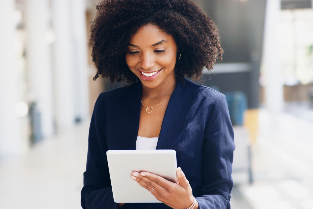 A woman using a tablet to showcase her products on Google My Business.