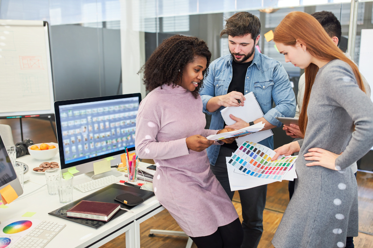 A group of people working together in an office, collaborating on projects and brainstorming ideas.