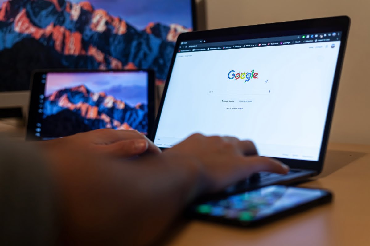 A person is using a laptop to submit a reinstatement request for their Google business profile.