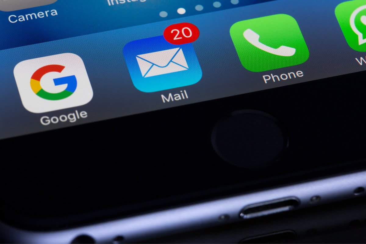 An iPhone is shown with a number of icons on it, including Google and search functionalities.