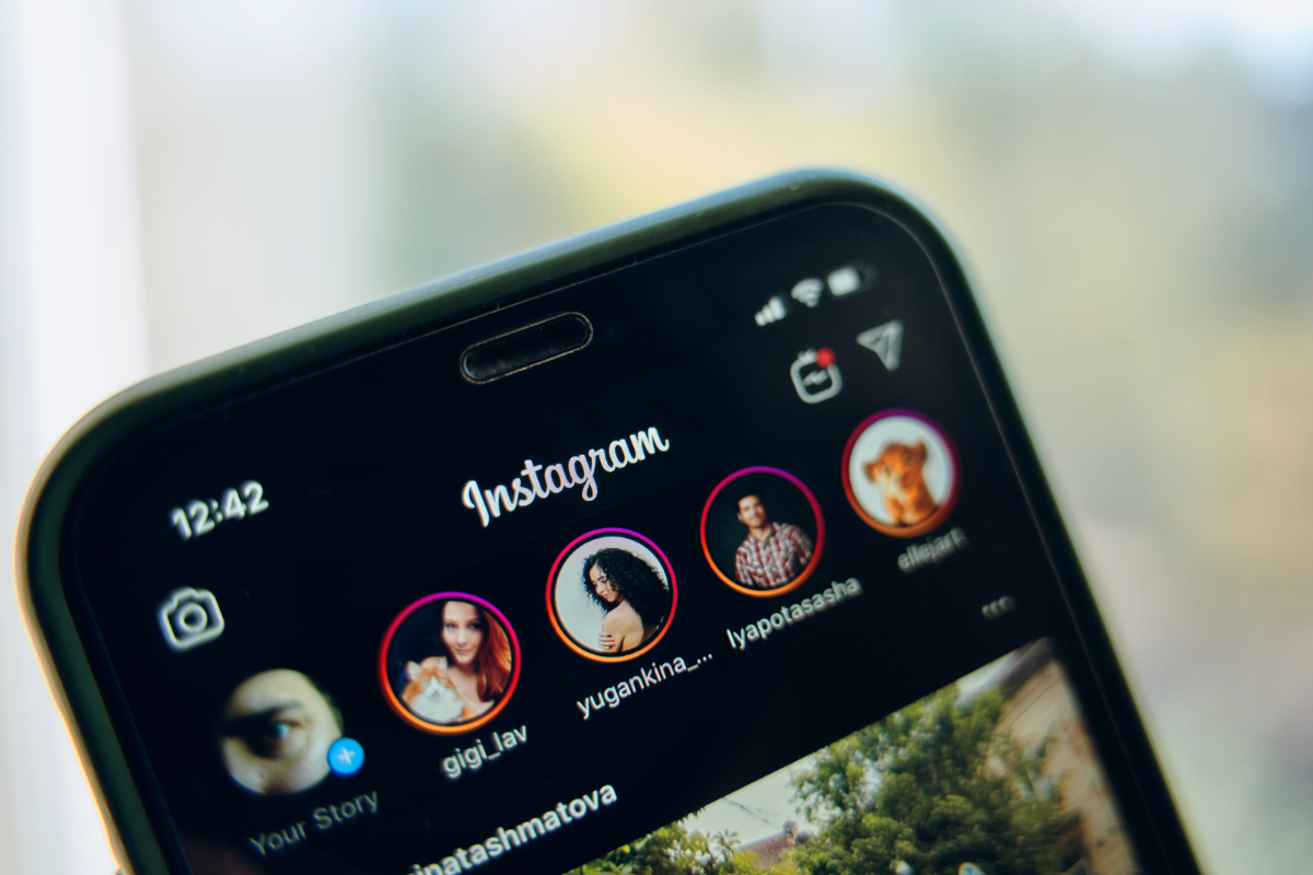 An Instagram app is displayed on a cell phone, showcasing the latest marketing strategy.