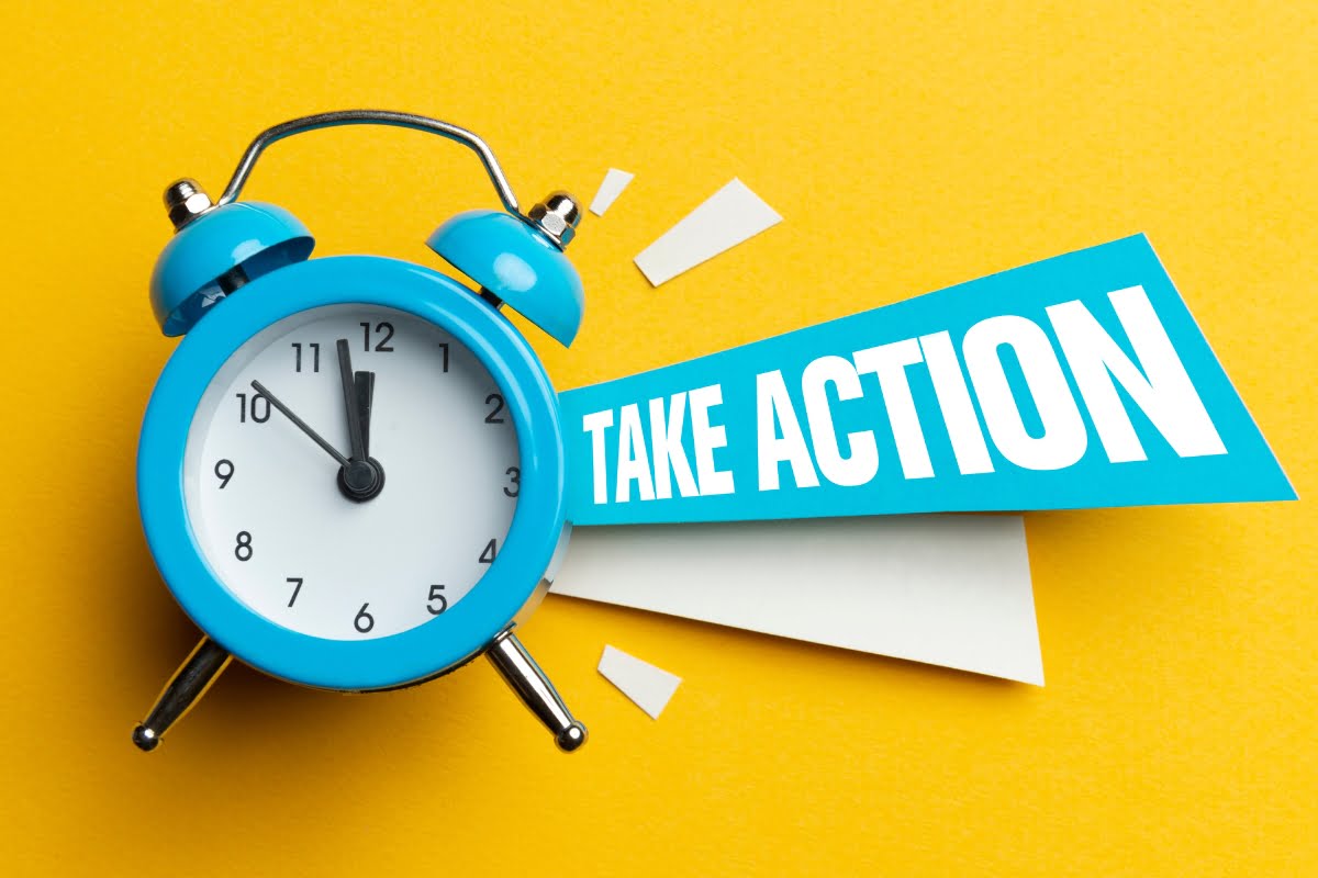 A blue alarm clock designed for landing page conversions with the word take action prominently displayed on its face.