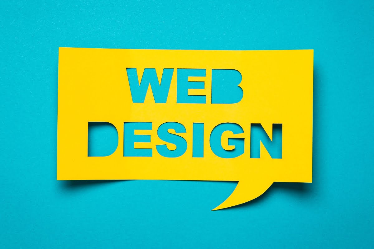 A yellow speech bubble with the word web design on it, perfect for redesigning a website.