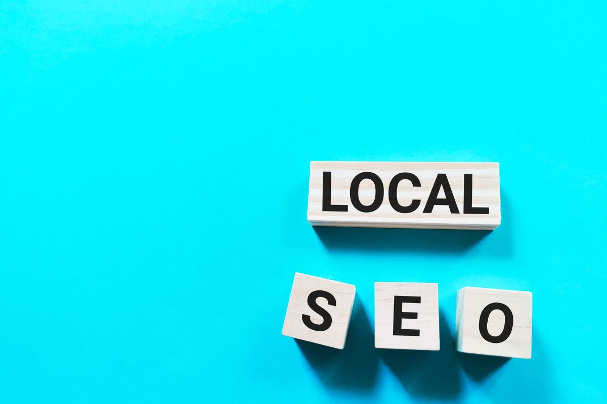 The word local SEO spelled out on a blue background, optimized for electricians.