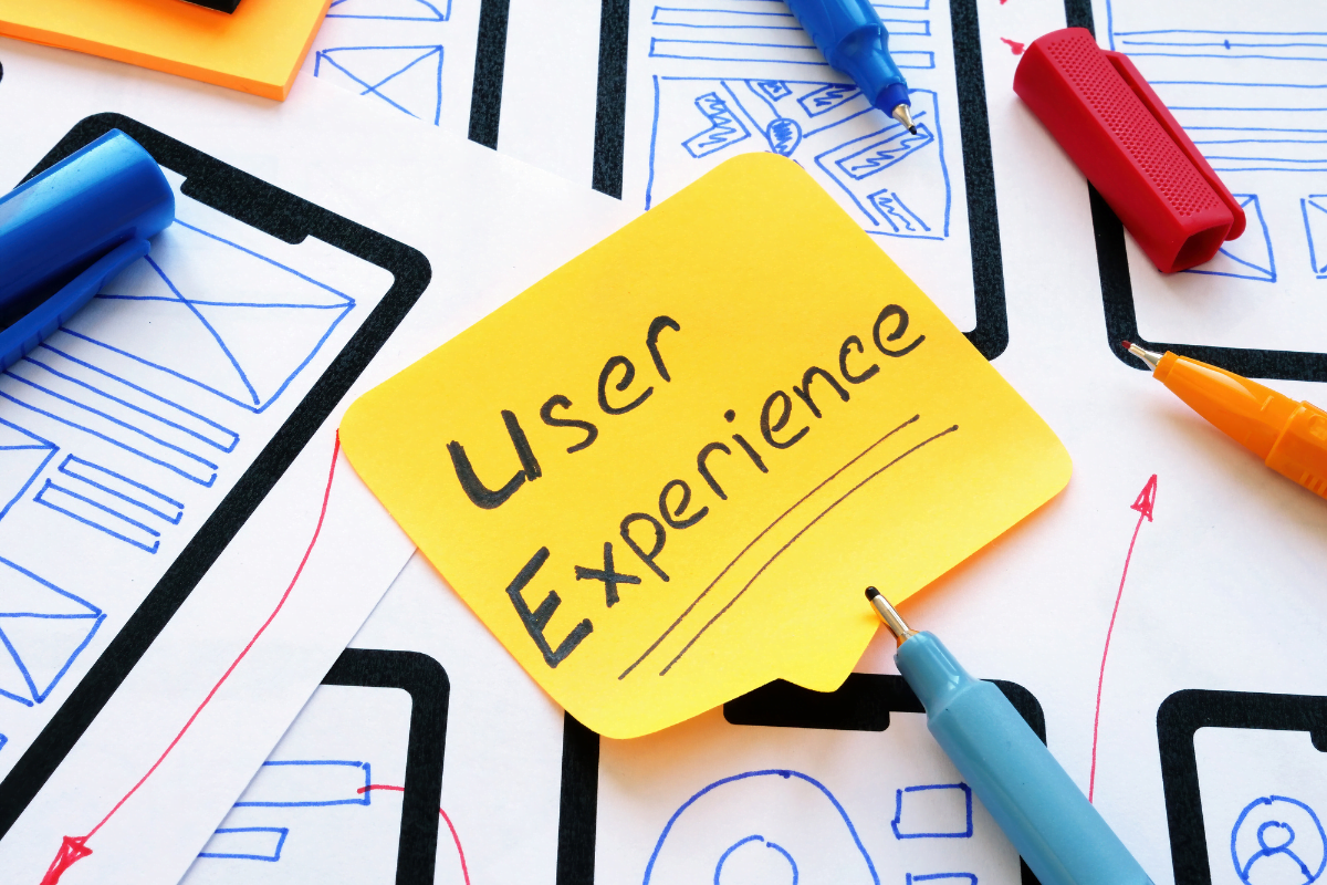 A sticky note with the word user experience on it, perfect for WordPress experts looking to enhance their website design.