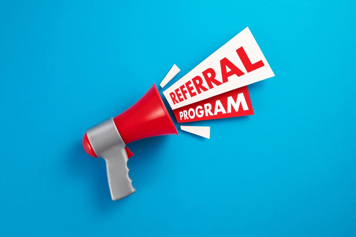 A megaphone with the word referral program on it, designed to attract catering clients.