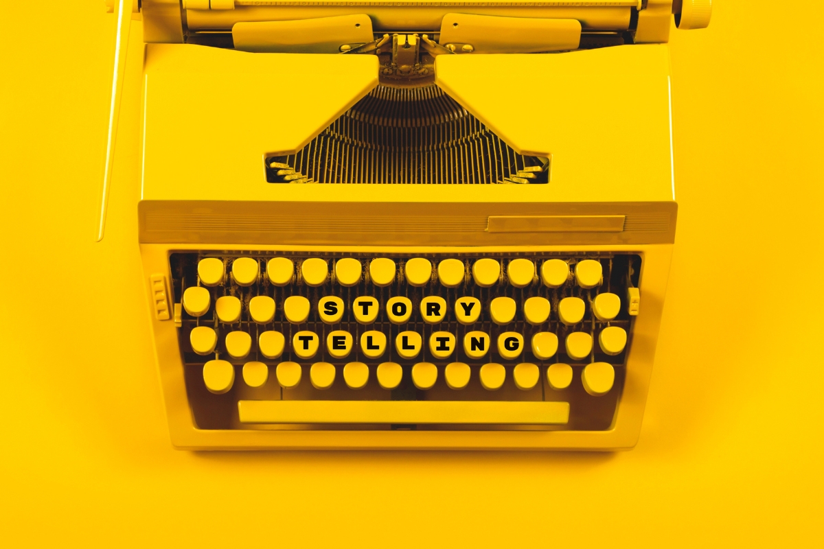 A yellow typewriter on a vibrant yellow background.