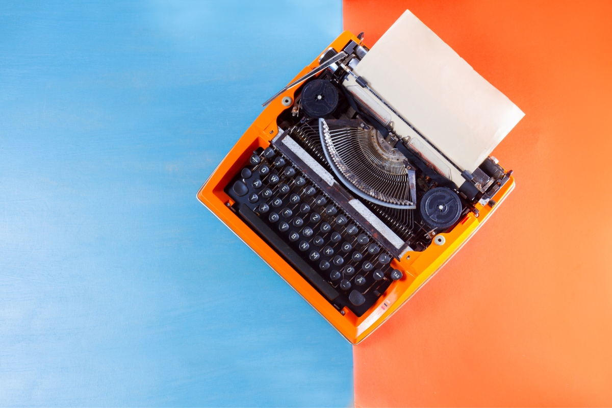 A vibrant typewriter on a colorful background.