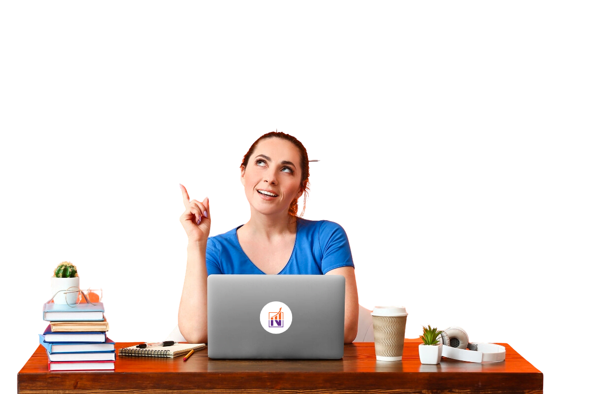 A woman sitting at a desk with a laptop in front of her.