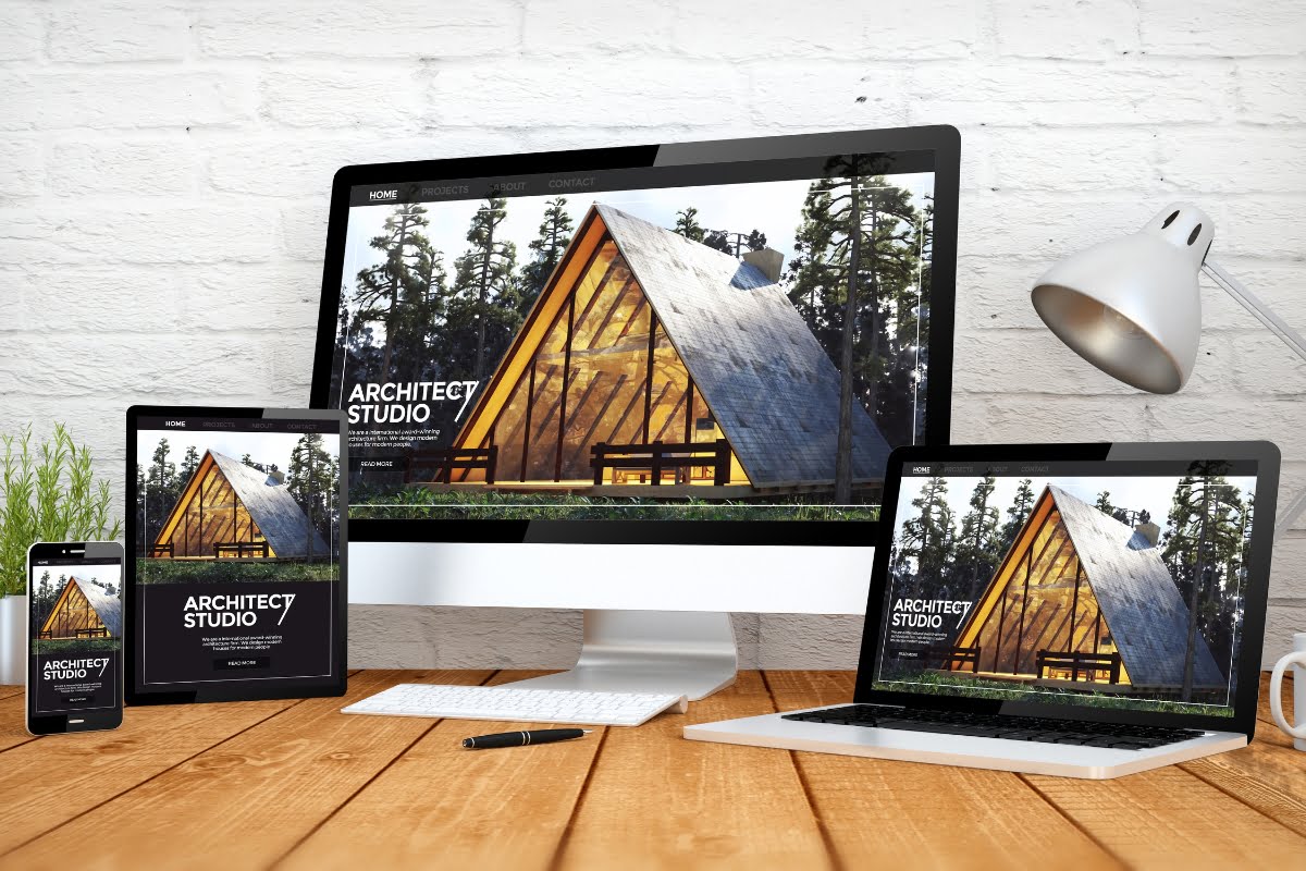 A laptop, tablet, and phone are displaying a visually appealing and user-friendly website for a cabin, built using responsive WordPress themes.