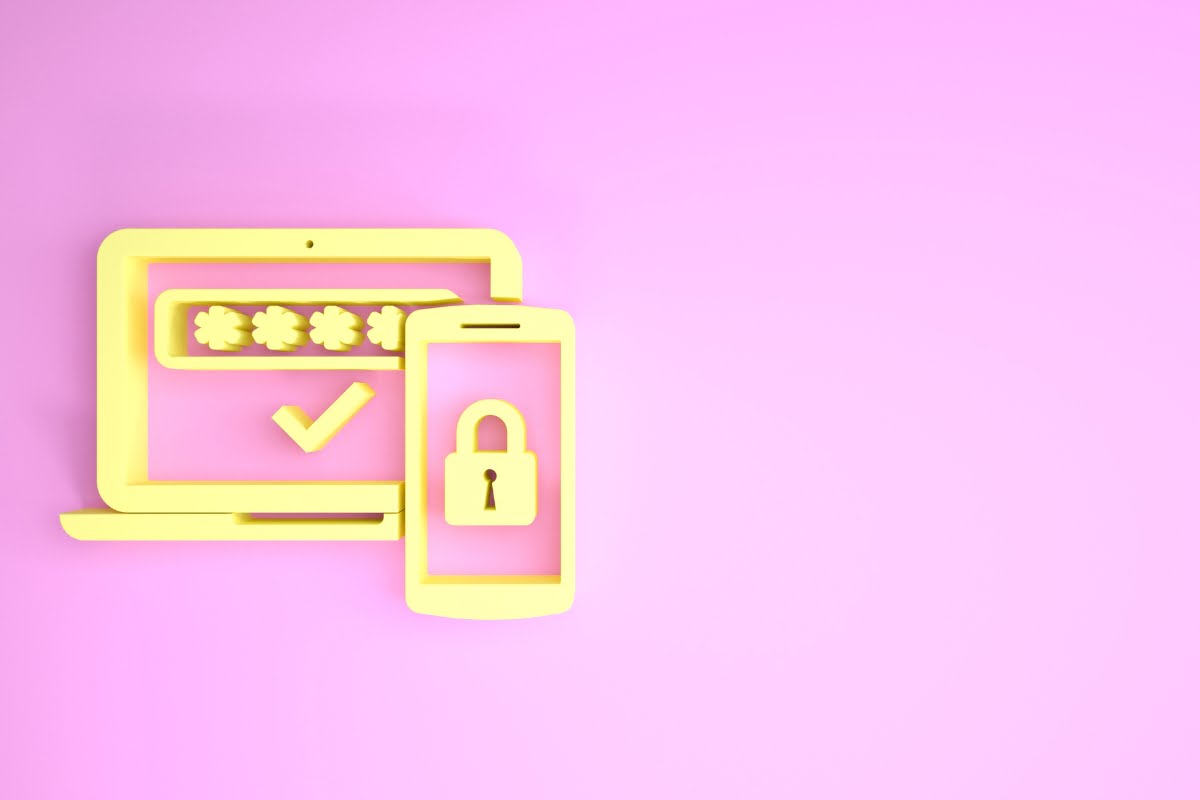 A laptop with a padlock on it on a pink background, emphasizing wordpress security.