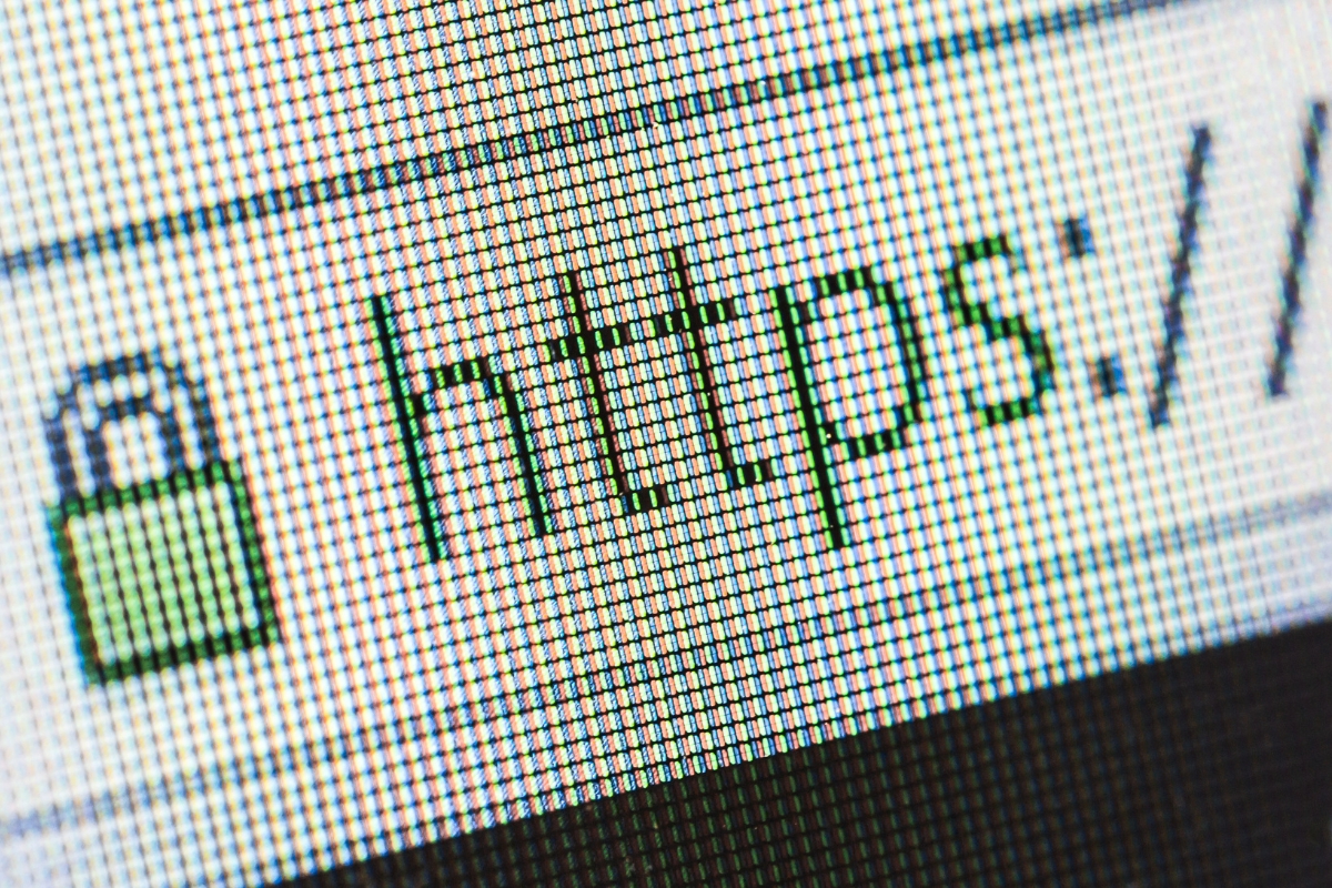 The image shows a padlock icon on a computer screen, indicating a secure connection with an https website.