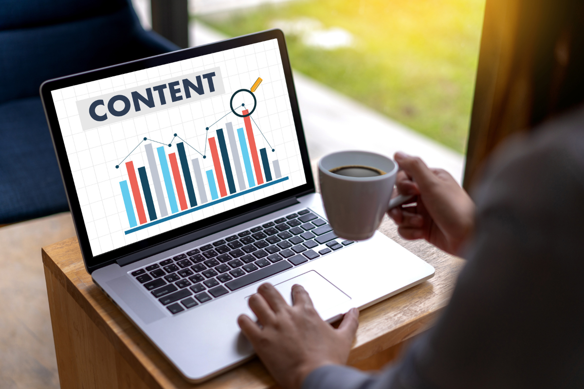 A woman measuring the success of a content strategy using her laptop.