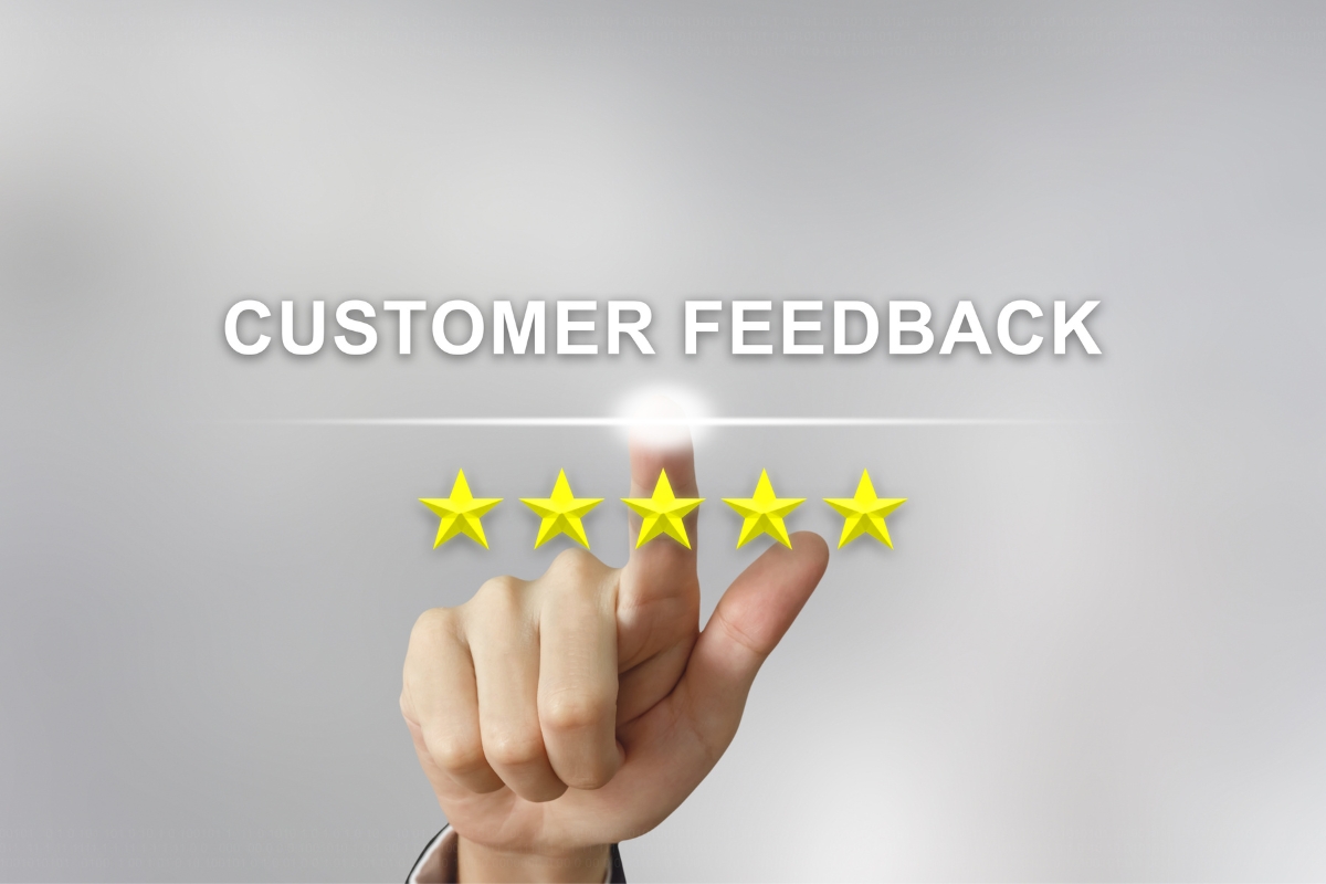 A hand is pointing at the word customer feedback in the marketing funnel stage.