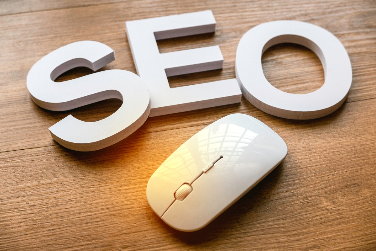 The word SEO spelled out on a wooden table.