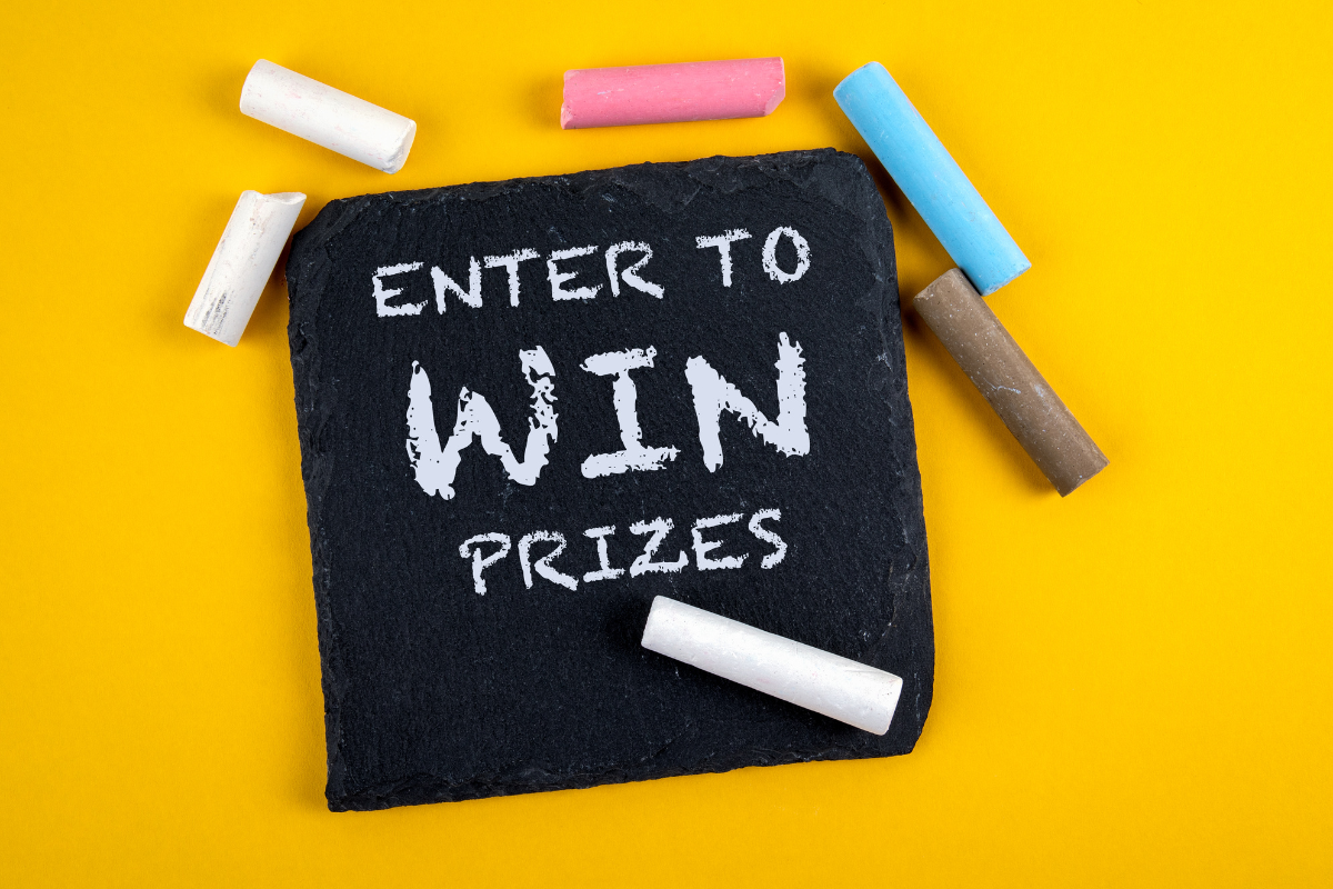 A chalkboard with the words "enter to win prizes" for viral giveaways.