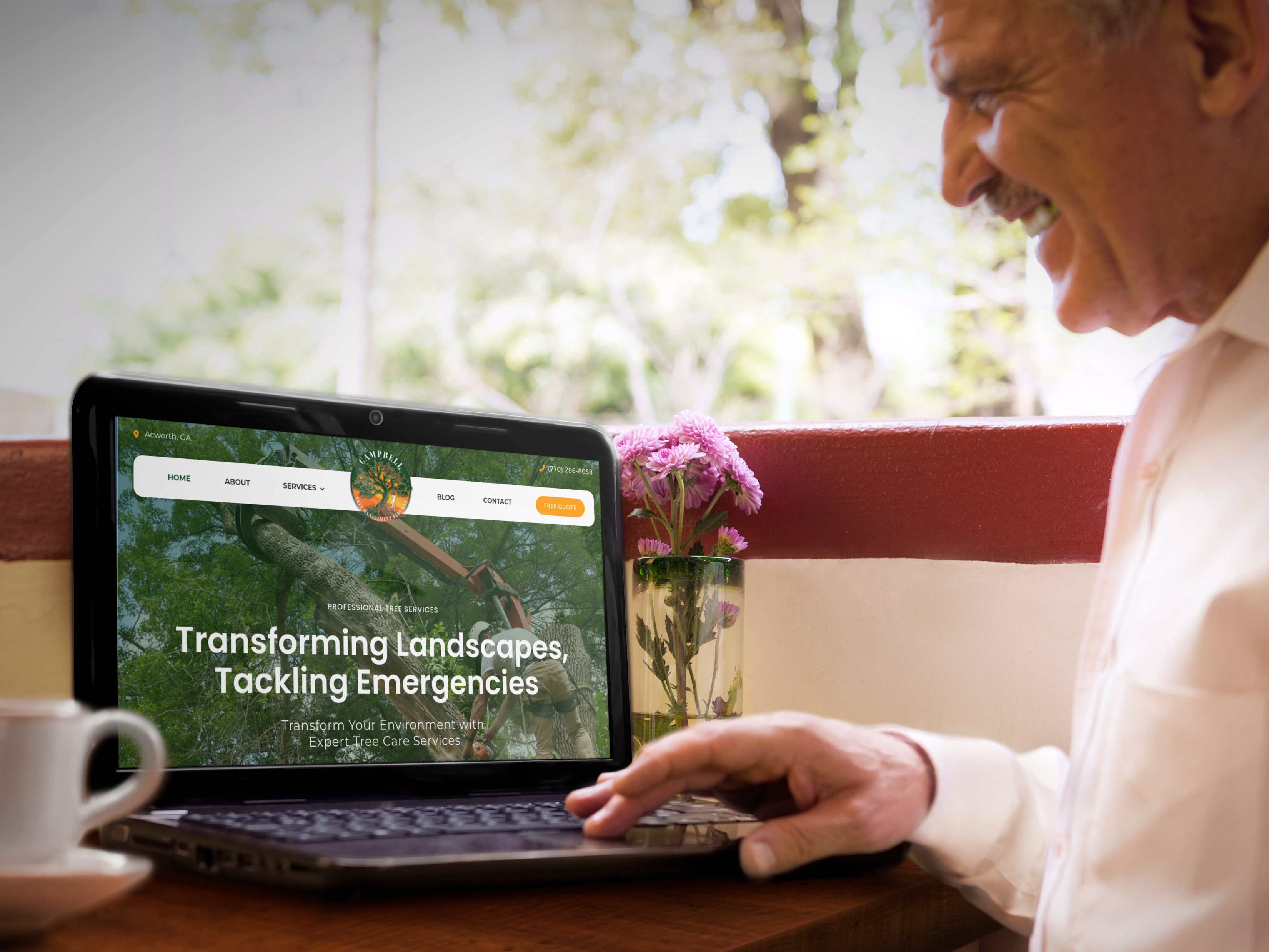 A photo of an older man browsing Campbell Tree Services new website on a laptop.