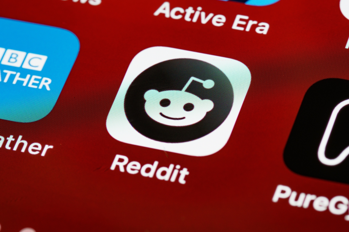 Close-up of the Reddit marketing app icon on a smartphone screen.