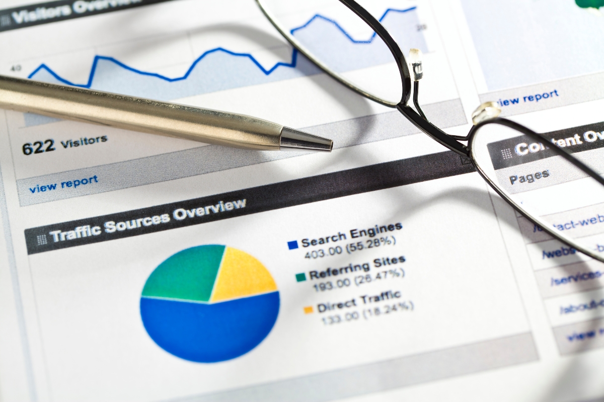 Eyeglasses and a pen on top of a graph with schema markup.