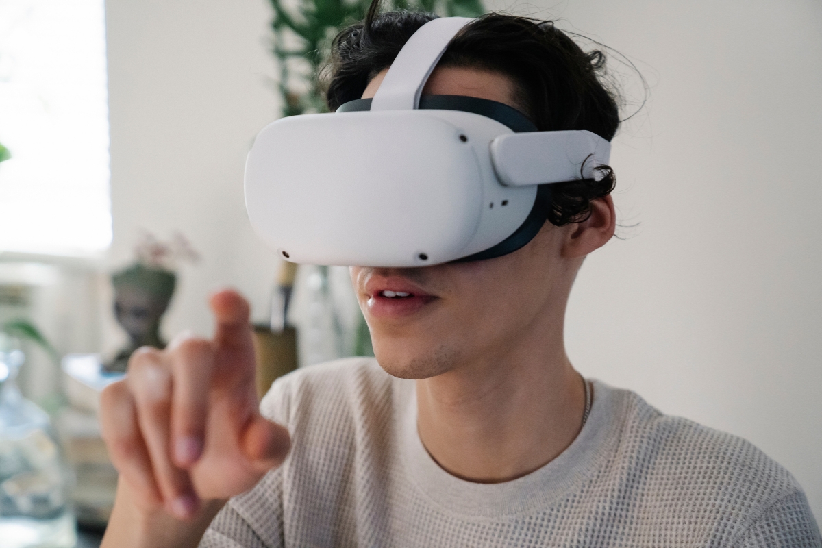 Person using a virtual reality headset and interacting with a virtual interface for small business marketing ideas.