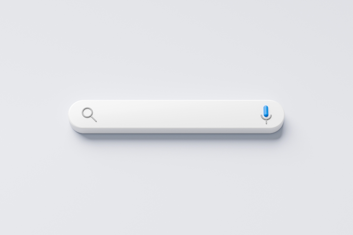 Minimalist digital search bar with a magnifying glass icon on the left and a circular blue button on the right, displayed against a plain light gray background, designed for intuitive website navigation.