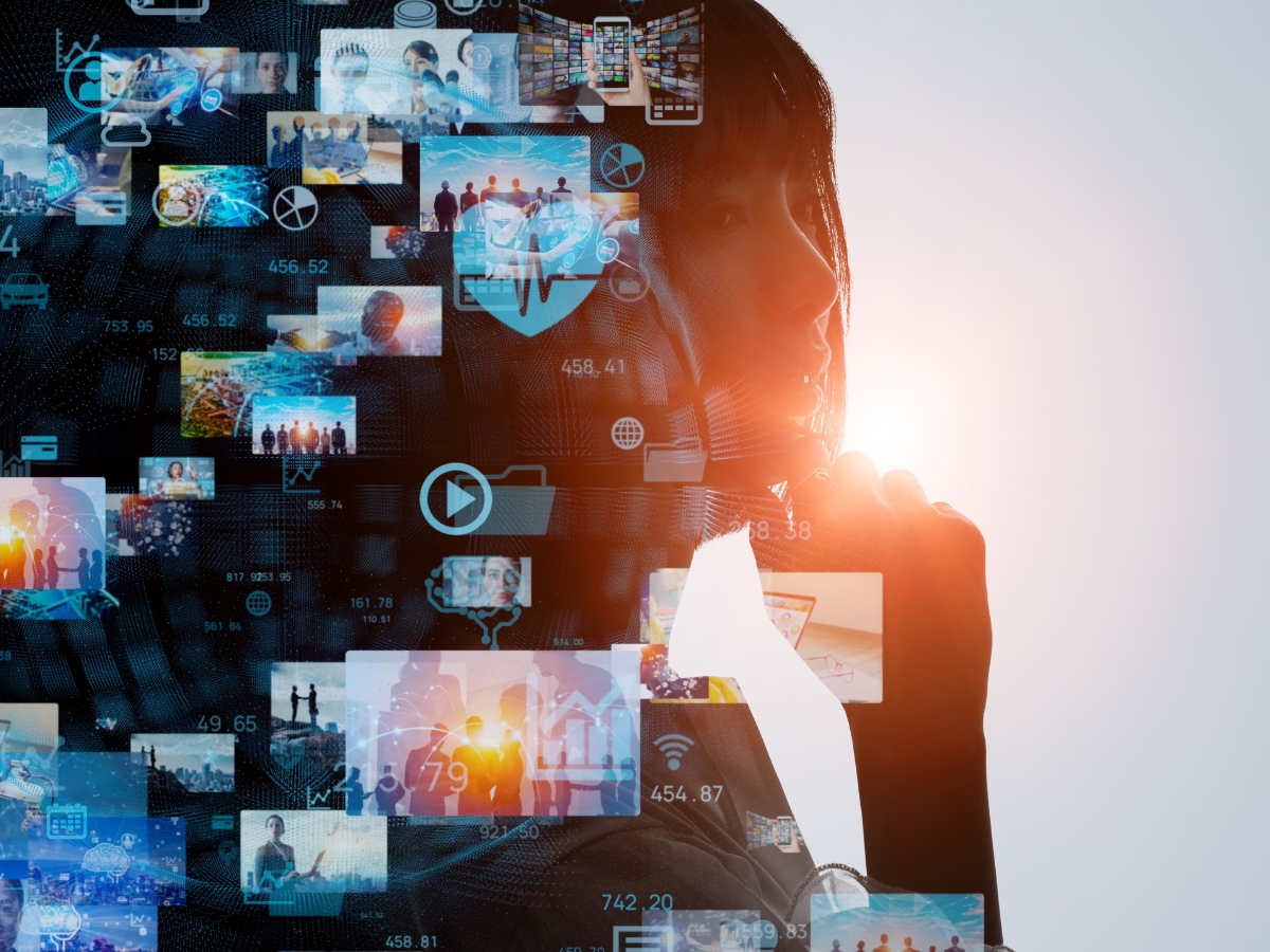 Silhouette of person with a collage of small images and technology icons overlaid, representing various types of media and digital content. A light source shines from behind, illuminating the silhouette—perfectly illustrating the power of local content marketing for small businesses.