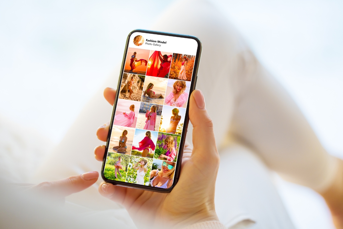 A person holding a smartphone displaying a social media profile with various fashion photos of a model wearing different outfits, perfectly illustrating why social media is important for showcasing personal style and inspiring fashion enthusiasts.