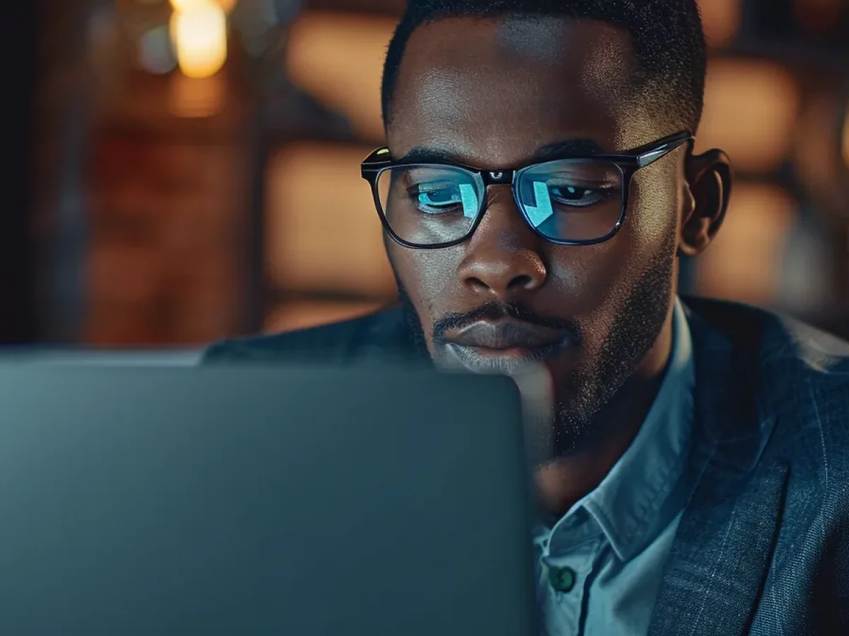 a confident cybersecurity specialist adjusting user role settings on a sleek laptop, with a secure padlock icon displayed prominently on the screen.